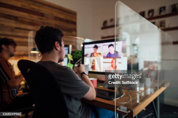 team meeting via video call - people social distancing stock pictures, royalty-free photos & images