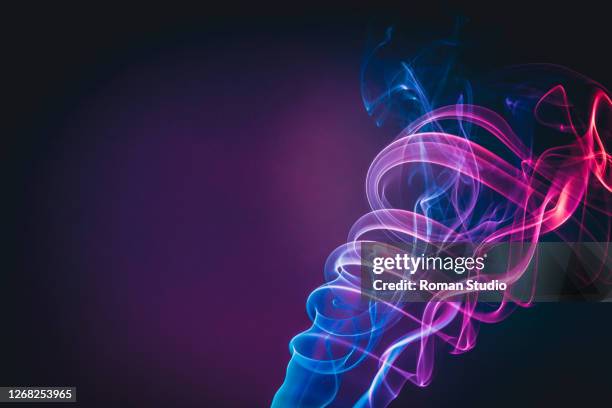 blue, pink, purple smoke on black background. vape, steam - blue smoke cigarettes fotografías e imágenes de stock