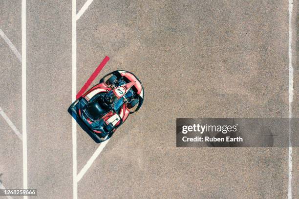 go kart parked on the pit stop, aerial view - gokartfahren stock-fotos und bilder