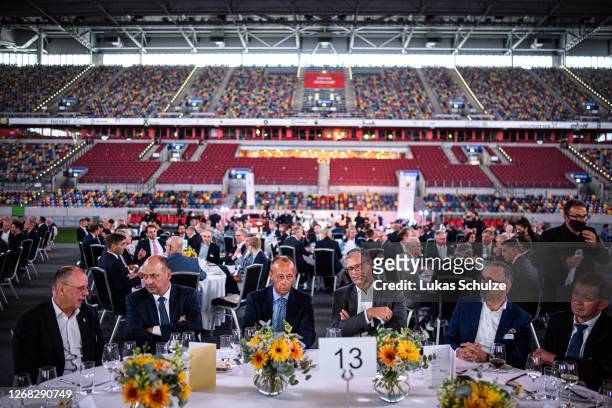 Politician Friedrich Merz sits on his table during the "Staendehaus Treff" dinner at the Merkur Spiel-Arena on August 24, 2020 in Dusseldorf,...