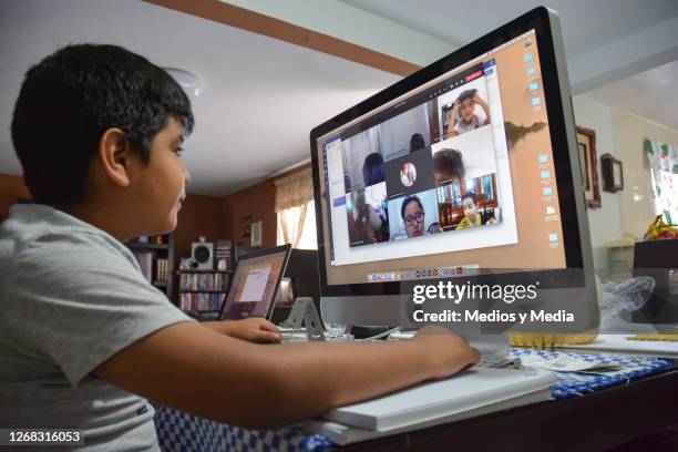 Student takes classes on a desktop IMac during the start of the school year from home on August 24, 2020 in Nezahualcoytl, Mexico. Mexican government...