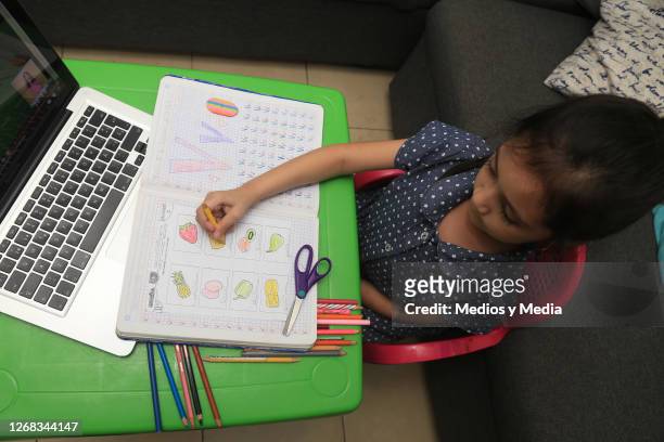Student takes classes on a Laptop during the start of the school year from home on August 24, 2020 in Monterrey, Mexico. Mexican government will not...