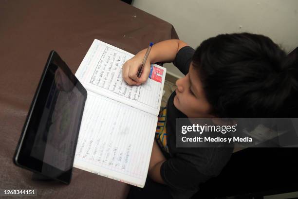 Student takes classes on a tablet during the start of the school year from home on August 24, 2020 in Monterrey, Mexico. Mexican government will not...