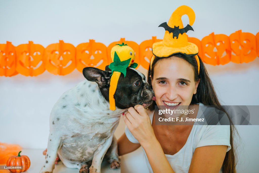 Woman celebrating halloween with her dog