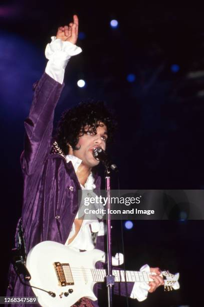 American singer, songwriter, musician, record producer, dancer, actor, and filmmaker Prince performs onstage during the 1984 Purple Rain Tour on...