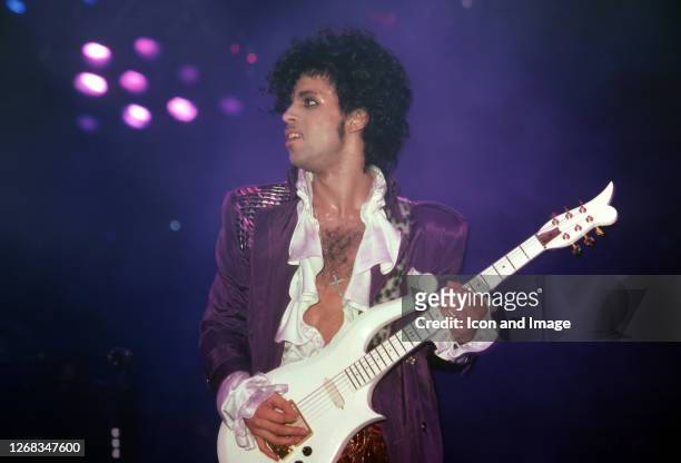 American singer, songwriter, musician, record producer, dancer, actor, and filmmaker Prince performs onstage during the 1984 Purple Rain Tour on...