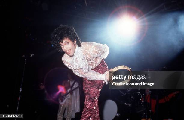 American singer, songwriter, musician, record producer, dancer, actor, and filmmaker Prince performs onstage during the 1984 Purple Rain Tour on...