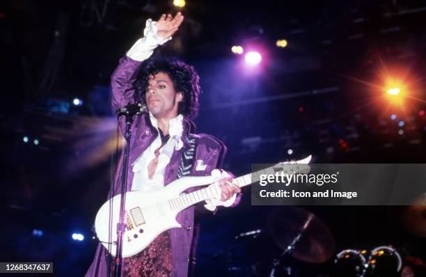 American singer, songwriter, musician, record producer, dancer, actor, and filmmaker Prince performs onstage during the 1984 Purple Rain Tour on...