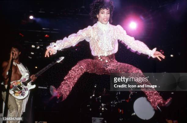 American singer, songwriter, musician, record producer, dancer, actor, and filmmaker Prince performs onstage during the 1984 Purple Rain Tour on...
