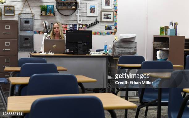 Kellie Goodall teaches an online eighth grade English class from her empty classroom at Walter Johnson Junior High School on the first day of...