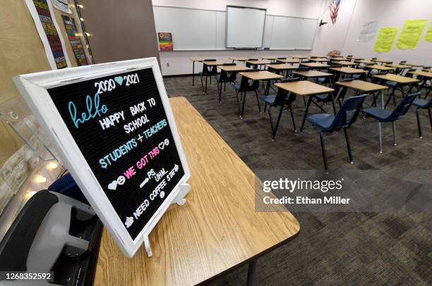 Back to school" message is displayed at the entrance to Kellie Goodall's empty classroom as she teaches an online eighth grade English class at...