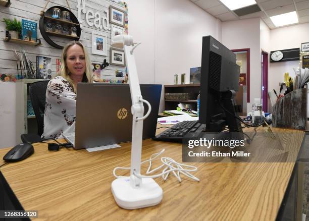 Kellie Goodall teaches an online eighth grade English class from her empty classroom at Walter Johnson Junior High School on the first day of...