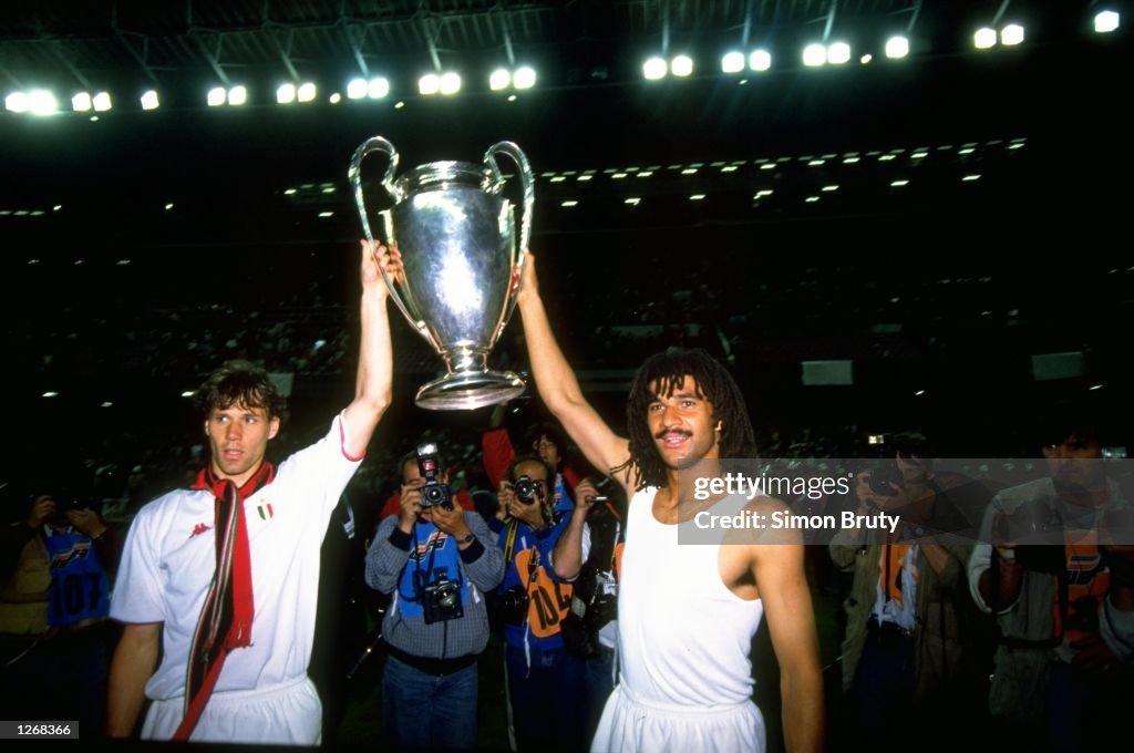 Marco Van Basten and Ruud Gullit of AC Milan celebrate with the trophy