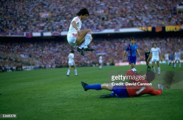 Marius Lacatus of Steaua Bucharest and Urruti of Barcelona in action during the European Cup Final match at the Sanchez Pizjuan Stadium in Seville,...