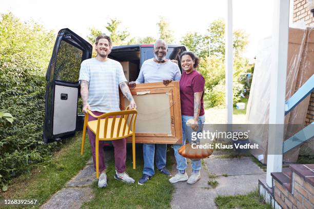 family standing against van outside new house - lawn mover stock pictures, royalty-free photos & images