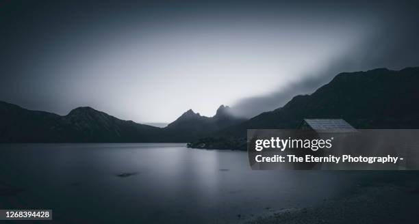 a midnight dream! dove lake with cradle mountain at its backdrop at dusk - black and white nature stock pictures, royalty-free photos & images