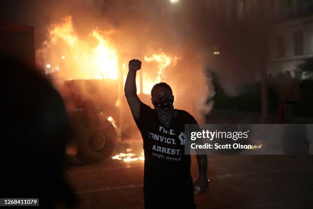 Fires burn around downtown during a second night of rioting on August 24, 2020 in Kenosha, Wisconsin. Rioting as well as clashes between police and...