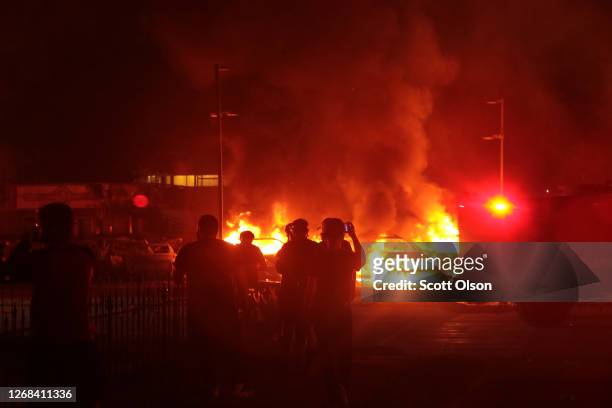 Fires burn around downtown during a second night of rioting on August 24, 2020 in Kenosha, Wisconsin. Rioting as well as clashes between police and...