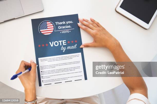 woman voting from home for the usa election - presidential election 2020 stock pictures, royalty-free photos & images