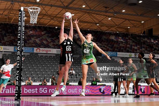 Emma Ryde of the Magpies and Courtney Bruce of the Fever compete for the ball during the round seven Super Netball match between the West Coast Fever...