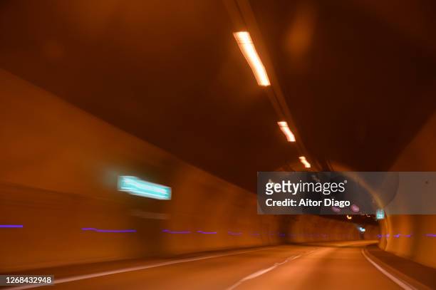 photo with movement at the exit of a tunnel - drunk driving crash stock pictures, royalty-free photos & images