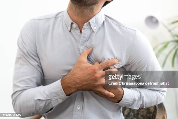 heart disease,business people have heart disease - chest foto e immagini stock