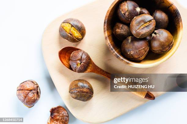 roasted chestnut - roasted chestnuts stock pictures, royalty-free photos & images
