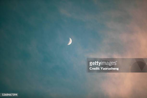 half moon in the sky - ramadan moon stockfoto's en -beelden