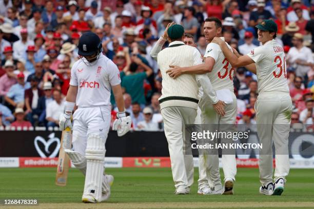 Australia's Josh Hazlewood celebrates with teammates after taking the wicket of England's Ben Duckett for 98 runs on day two of the second Ashes...