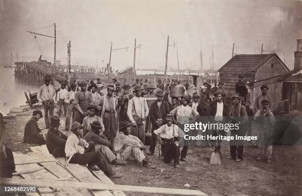 Laborers at Quartermaster's Wharf, Alexandria, Virginia, 1863-65. Formerly attributed to Mathew B. Brady. Artist Attributed to Andrew Joseph Russell.