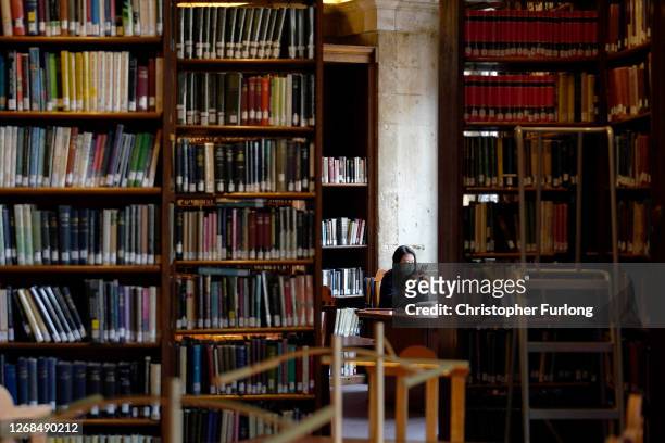An academic studies in the Radcliffe Camera at the Bodleian Libraries on August 25, 2020 in Oxford, England. The world famous libraries closed in...