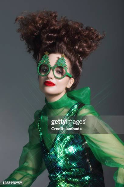 fashionable woman wearing funny christmas party glasses - crazy party imagens e fotografias de stock