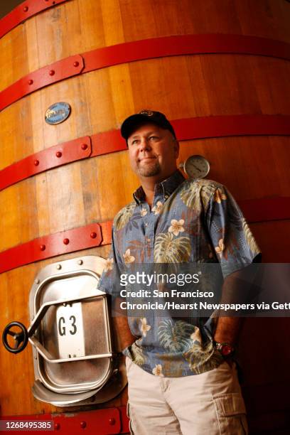 Chris Dearden, winemaker for Benessere in St. Helena, Calif. On July 25, 2008. He makes Italian-style wines and he standing next to an open top...