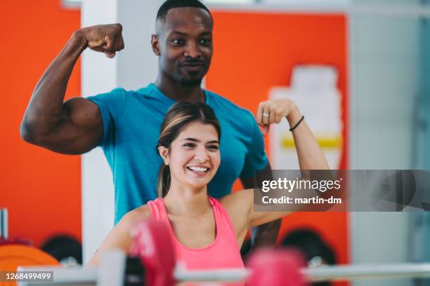 couple sports training in the gym - young couple mirror stock pictures, royalty-free photos & images