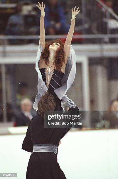 Sergei Ponomarenko lifts up Marina Klimova both of the Eastern Unified Natrions during the Ice Dancing event at the 1992 Winter Olympics in...