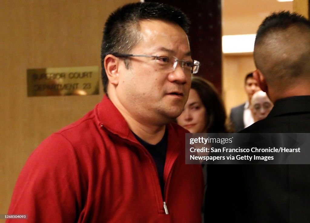 Terry Hui, the son of Sutchi Hui, leaves court after the sentencing ...