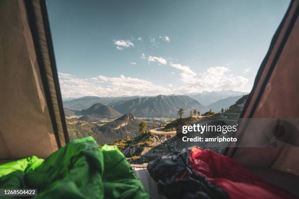 looking through open window of car roof tent high up in beautiful mountains - car roof stock pictures, royalty-free photos & images