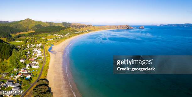 opito bay on new zealand's coromandel peninsula - new zealand beach house stock pictures, royalty-free photos & images