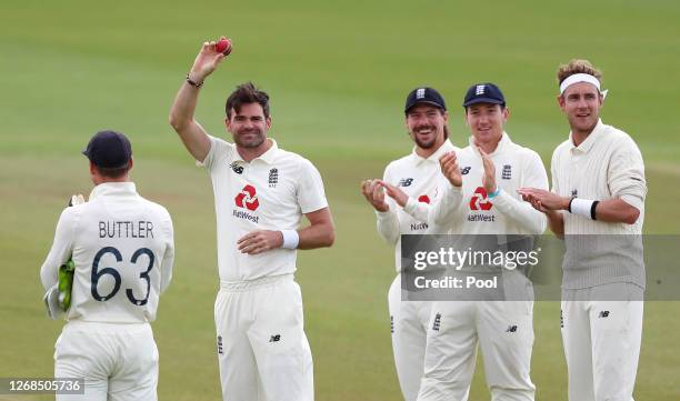 James Anderson of England acknowledges the changing rooms whilst being applauded by Rory Burns, James Bracey and Stuart Broad of England after taking...