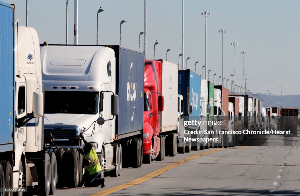 Line Up Terminal Big rig trucks line up to enter the Port of Oakland terminals on ...