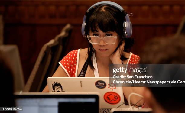 Romy Ilano, opt Oakland an IOS developer works away during a Hackathon to create business applications related to politics, taking place on during a...