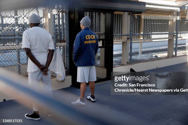 Condemned prisoner Scott Peterson, with a fellow inmate is seen in the exercise area of during a tour of North Segregation of death row at San...