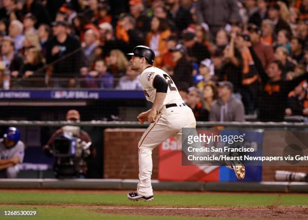 Giants' Conor gillespie hits a single in the fifth inning to score Hunter Pence, as the San Francisco Giants take on the Chicago Cubs in game 4 of...