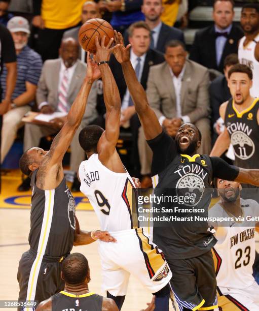 Golden State Warriors' Draymond Green and Andre Iguodala block a New Orleans Pelicans' Rajon Rando shot in the second quarter during game 2 of the...