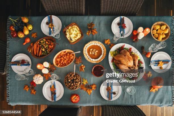 thanksgiving party table setting traditional holiday stuffed turkey dinner - candle overhead stock pictures, royalty-free photos & images