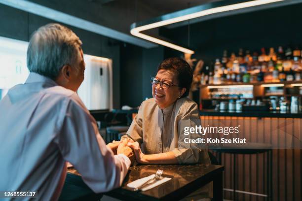 Senior couple dining out during Coronavirus epidemic
