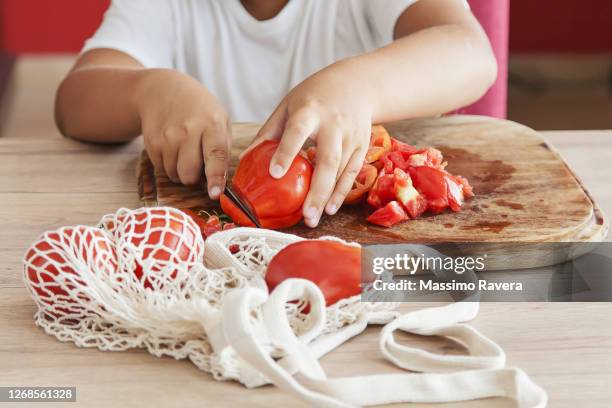 young boy cutting food - kitchen knife stockfoto's en -beelden