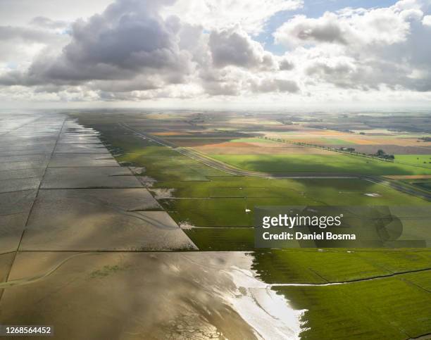 the cultivated coastline of the netherlands seen from the air - groningen netherlands stock pictures, royalty-free photos & images