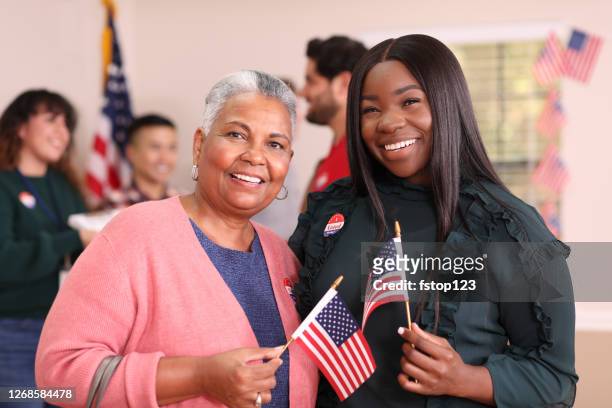 friends or mother, daughter are all smiles as they vote in usa election. - citizenship stock pictures, royalty-free photos & images