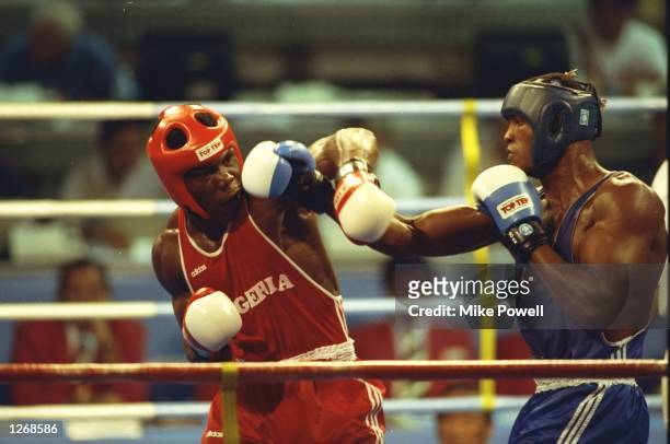 Felix Savon of Cuba and Richard Igbineghu of Nigeria in action during the Final of the Heavyweight Boxing event at the 1992 Olympic Games in...